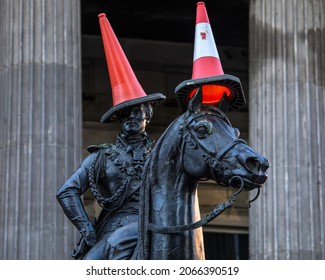 The famous statue of the Duke of Wellington, located on Royal Exchange Square in Glasgow, Scotland.  The statue is typically capped with a traffic cone which has become a tradition.