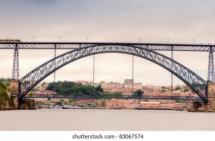 Famous steel bridge Ponte dom Luis above  connects Old town Porto with Vila Nova de Gaia at river Duoro, Portugal  Vintage look
