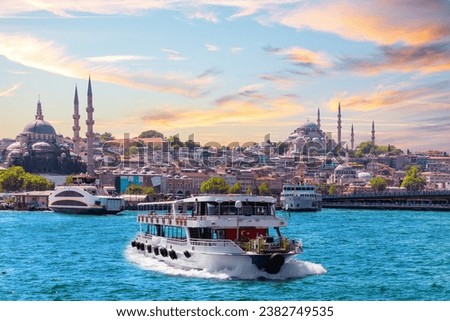 Famous Suleymaniye and Rustem Pasha Mosques and the cruise boat on the Bosphorus, popular place of Istanbul, Turkey