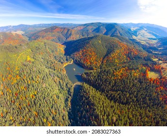 The famous Synevyr lake, a tourist attraction, in the Carpathians, Ukraine, autumn beech and coniferous forest, beautiful mountain landscape. Aerial view drone copter - Shutterstock ID 2083027363