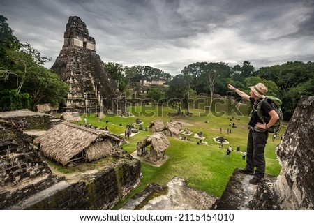 Famous Tikal pyramid with standing tourist woman, Guatemala, Central America