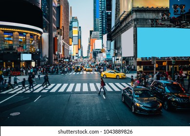 Famous Times Square landmark in New York downtown with mock up billboards for advertising and commercial information content. Big metropolis urban scene with development infrastructure with Lighboxes - Shutterstock ID 1043889826