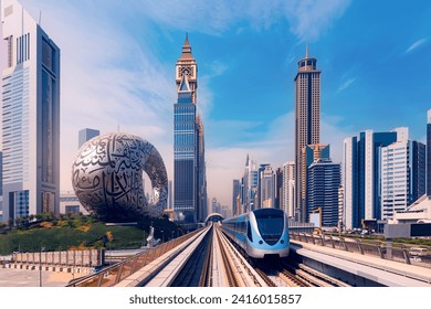 Famous tourist landmark Dubai, cityscape with skyscrapers. Modern metro railway with sun light. Luxury Business and financial district of city UAE.