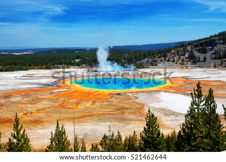 Famous trail of Grand Prismatic Springs in Yellowstone National Park from high angle view. Beautiful  hot springs with vivid color blue green orange in Wyoming.