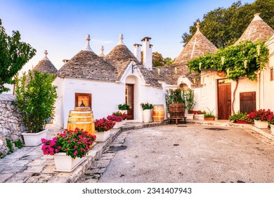 Famous Trulli Houses during a Sunny Day with Bright Blue Sky in Alberobello, Puglia, Italy - Shutterstock ID 2341407943