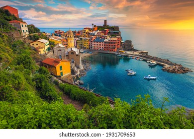 Famous Vernazza village view with colorful houses and small harbor at sunset, Cinque Terre, Liguria, Italy, Europe