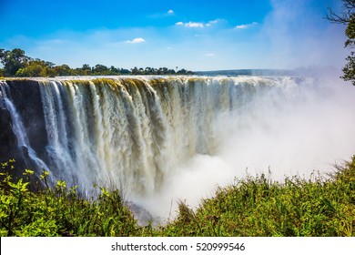 The famous Victoria Falls on the Zambezi River in South Africa. At the end of the rainy season, the waterfall most high water
