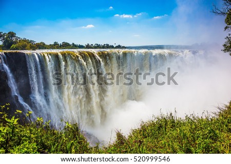 The famous Victoria Falls on the Zambezi River in South Africa. At the end of the rainy season, the waterfall most high water Сток-фото © 