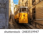 Famous vintage yellow tram  in the narrow streets of Alfama district in Lisbon, Portugal - symbol of Lisbon, famous popular travel destination and tourist attraction