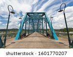 The famous Walnut Street Bridge is a pedestrian bridge that crosses over the Tennessee River in downtown Chattanooga, TN.