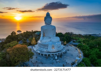 Famous white Big Buddha statue on the top of the hill in Phuket, aerial sunset view