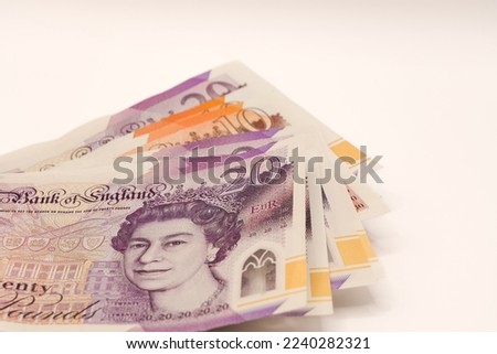 a fan arrangement of new GBP £ Sterling Twenty 20 and Ten 10 pound notes