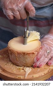 Fan Cutting Of Cheese With Knife Girolle By Hands On Wooden Board