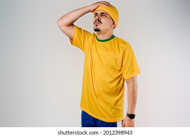 Fan Disappointed With The Result Of The Game, Wearing A Yellow S