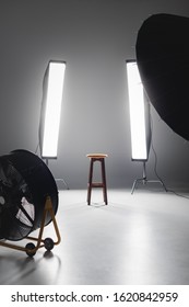 Fan, Reflector, Wooden Stool And Lights On Backstage In Photo Studio