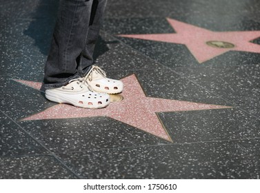 A Fan Standing On Her Idol's Star