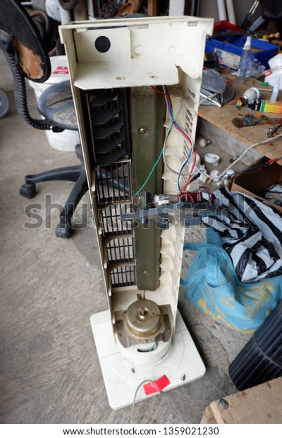 a fan\
that has been damaged and is being\
repaired