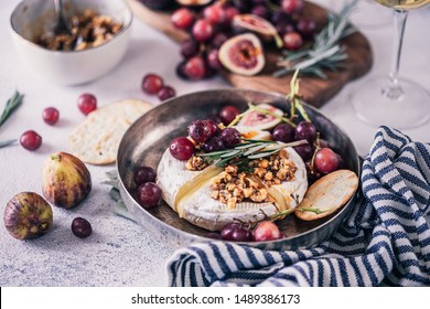 Fancy Baked Brie Cheese Platter With Honey And Walnuts, Fresh Rosemary. Red Grapes, Figs And White Wine