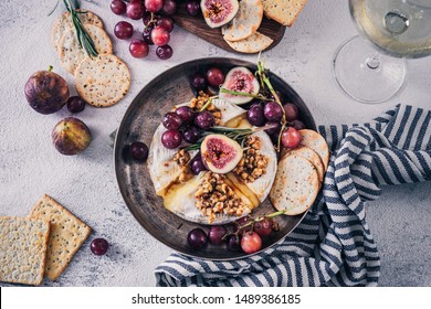 Fancy Baked Brie Cheese Platter With Honey And Walnuts, Fresh Rosemary. Red Grapes, Figs And White Wine