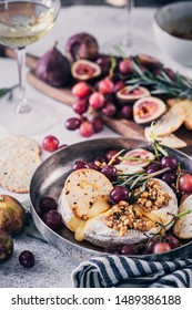 Fancy Baked Brie Cheese Platter With Honey And Walnuts, Fresh Rosemary. Red Grapes, Figs And White Wine