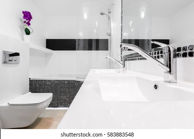 Fancy Bathroom Interior With Two White Classical Washbasins And Faucets