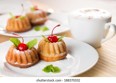 Fancy Cakes Dessert With Cappuccino Coffee On Table