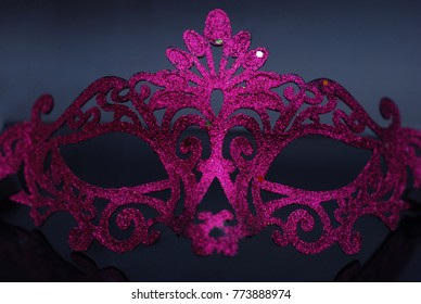 Fancy Carnival Festive Accesories,  Purple Pink Shinny Mask Isolated On Dark Blue Background