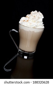 A Fancy Coffee Beverage On A Reflective Black Surface