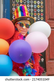 Fancy dress shop decorated with a mannequin with colourful balloons and sun glasses. London - 2nd July 2022