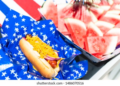 Fancy hot dog on a white and blue basket liner at July 4th party.