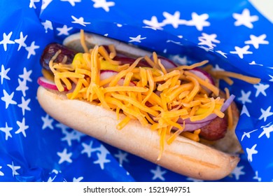 Fancy Hot Dog On A White And Blue Basket Liner At July 4th Party.