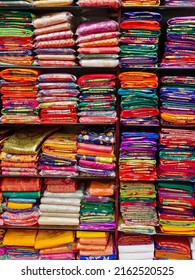 Fancy Indian Sarees, Neatly Stacked Colorful Silk Saris In Racks In A Textile Shop. Incredible India.