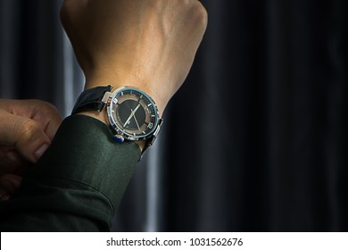 Fancy Luxuryous Watch For Men. Businessman Adjusting Green Shirt And Watch. A Hand And A Watch.