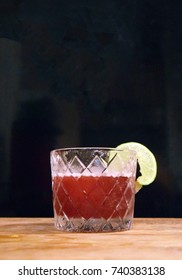 Fancy Red Cocktail In Retro Prohibition Era Glass On Wood Table