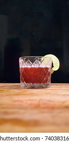 Fancy Red Cocktail In Retro Prohibition Era Glass On Wood Table