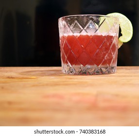 Fancy Red Cocktail In Retro Prohibition Era Glass On Wood Table