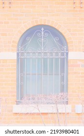 Fancy Vintage Iron Grating On A Huge Arched Window In A Bright Faded Color Film Negative.