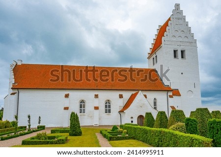 Fanefjord Church in Denmark during a cloudy day.