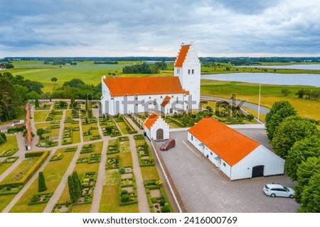 Fanefjord Church in Denmark during a cloudy day.
