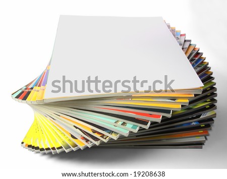 Fanned stack of magazines on white background, with fierst top for mockup 