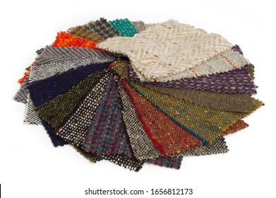 Fanned Swatch Of Irish Tweed Woven Wool Cloth In A Variety Of Different Colors And Textures.  