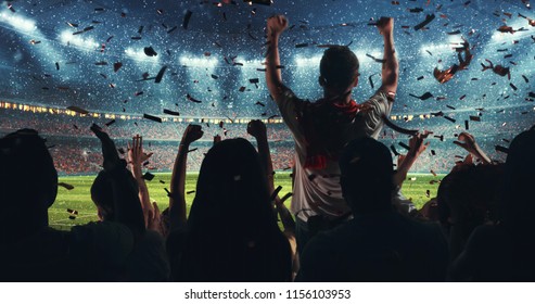 Fans Celebrating The Success Of Their Favorite Sports Team On The Stands Of The Professional Stadium While It's Snowing. Stadium Is Made In 3D.