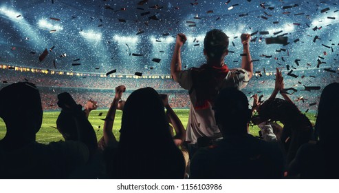 Fans celebrating the success of their favorite sports team on the stands of the professional stadium while it's snowing. Stadium is made in 3D.