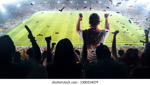 Fans celebrating the success of their favorite sports team on the stands of the professional stadium. Stadium is made in 3D.