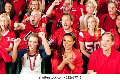 Fans: Crowd Of Cheering Football Fans In Stadium Seats