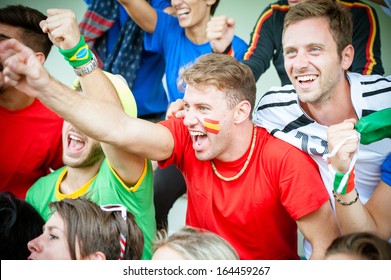 Fans of different nations at the stadium together - Stock Image - Powered by Shutterstock