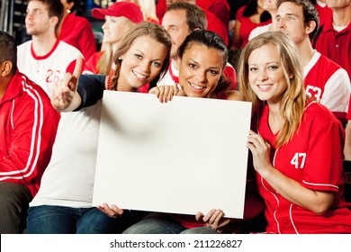 Fans: Girl Friends Hold Up Sign At Baseball Game