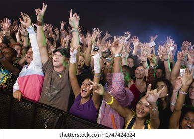 Fans Screaming And Cheering Behind Fence