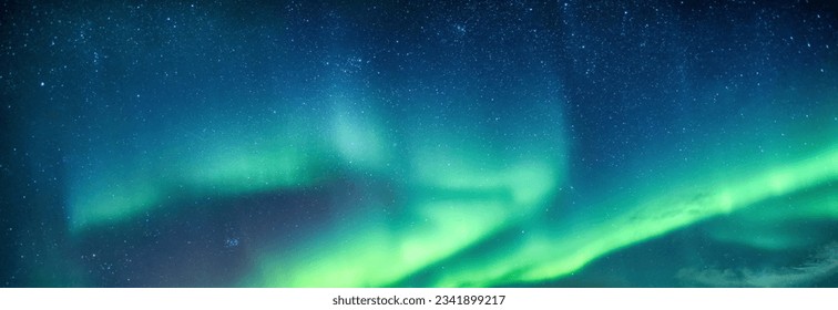 Fantastic Aurora borealis or northern lights with starry glowing in the night sky on Arctic circle at Norway