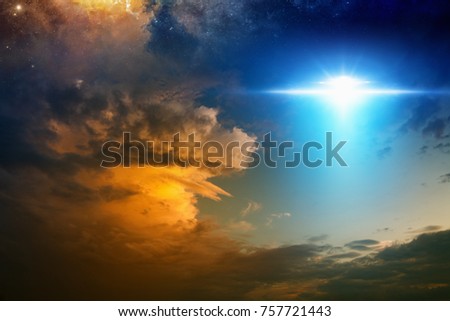 Fantastic background - bright light from extraterrestrial aliens spaceship, ufo  in red glowing sunset sky. Elements of this image furnished by NASA